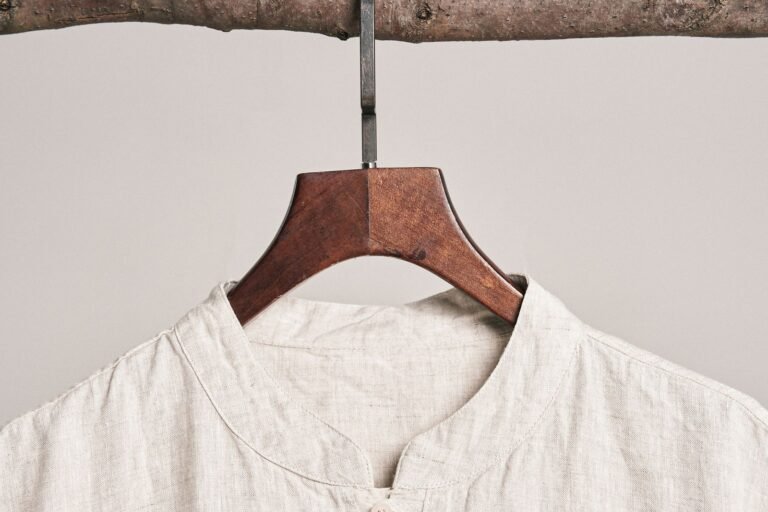 White linen shirt on a wooden hanger — white clothes dry cleaning Sydney