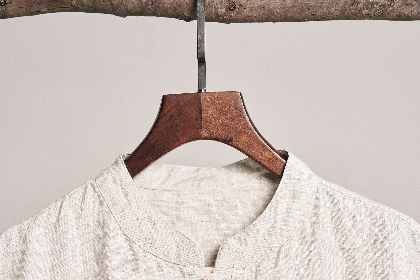 White linen shirt on a wooden hanger — white clothes dry cleaning Sydney